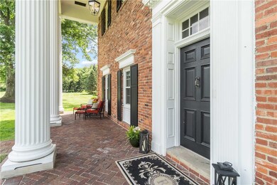 An enchanting front porch highlighted by 22 foot c