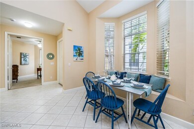 Dining area with ceiling fan, vaulted ceiling, and