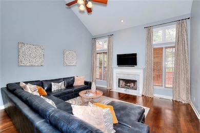 Living area with plenty of natural light, high vau