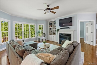 Family room features hardwood floors, a gas firepl