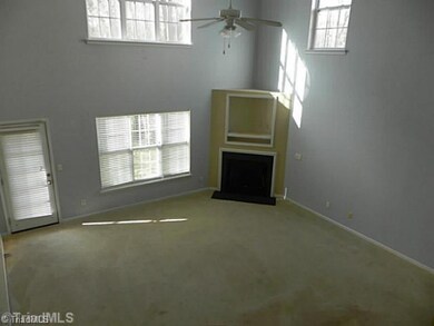 Living Room. High ceilings and fireplace.