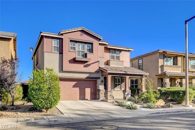 View of front of property featuring driveway, a ga