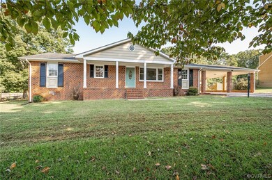 Ranch-style home with a front lawn