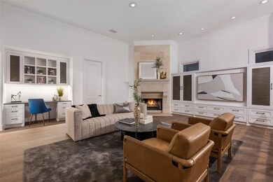 Living area with ornamental molding, wood finishe