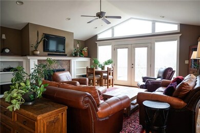 Another view.  Built in bookcases and propane gas log fireplace.