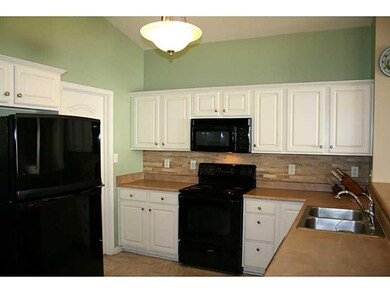 Kitchen. Check out the custom tile backsplash behind the stove.