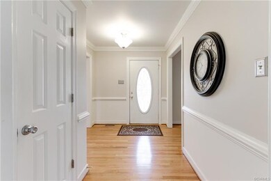 Foyer details crown & chair molding, coat closet &