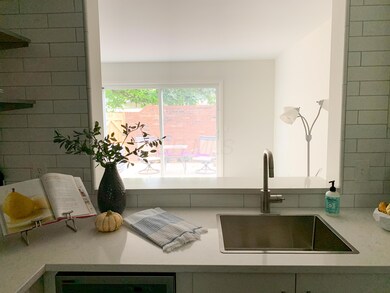 VIEW FROM INTERIOR KITCHEN WINDOW