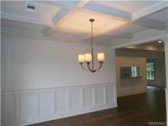 DINING ROOM HAS A COFFERED CEILING, WAINSCOTING AN