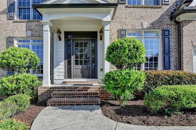 Property entrance featuring brick siding