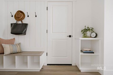 Mudroom with light wood-style flooring