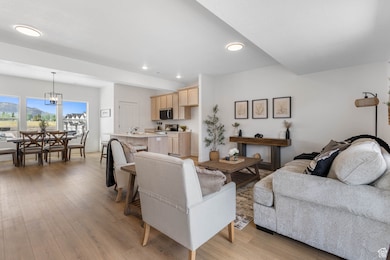 Living room featuring light wood-type flooring and recessed lighting