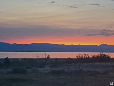 View of mountain backdrop featuring a nearby body of water