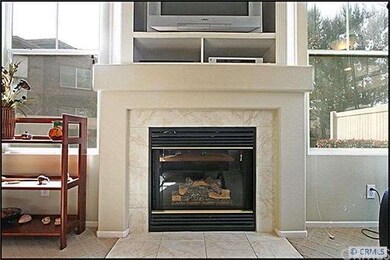 Tile-accented fireplace and built-in entertainment