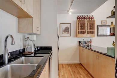 Undermount sink plus an open serving bar area, com