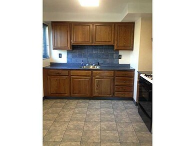 Kitchen. Updated Kitchen with wood cabinets.