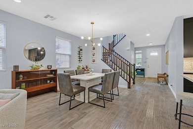Dining room featuring stairway, light wood-type fl