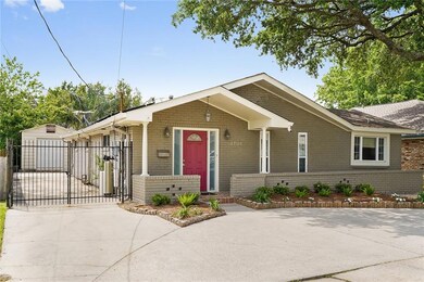 Front/Side of home with workshop in backyard.