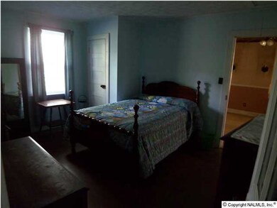 Master Bedroom features wood floor