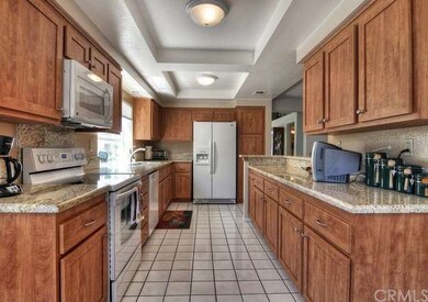 The kitchen features gorgeous granite slab counter