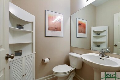 Powder room on first level with tiled floors