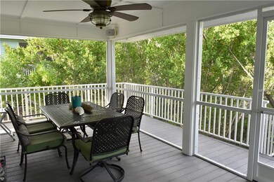 Entry porch provides space for outside dining!