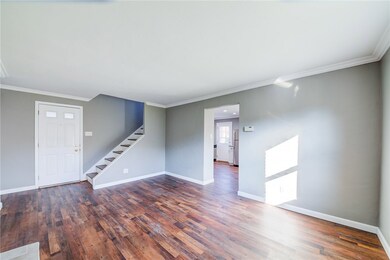 ENTER IN TO THE LIVING ROOM W/ MATTE FINISHED CEMENT BOARD ENGINEERED HARDWOOD FLOORING