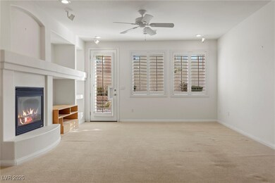 Unfurnished living room featuring carpet floors, b