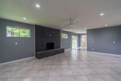 Living room with plenty of natural light and firep