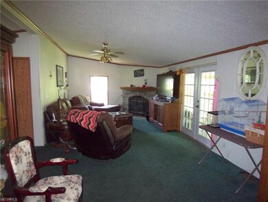 Living room with French doors...carpet is being re