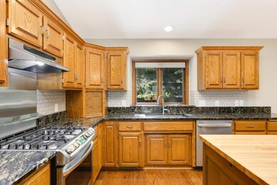 Impressive hard surface countertops and ample cabinet space.