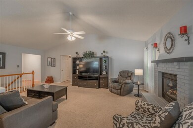 Large great room with vaulted ceilings and firepla