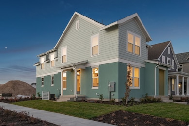 View of front of home featuring a front lawn, stucco siding, and a mountain view