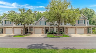 View of front of property featuring brick siding, a garage, roof with shingles, and a porch