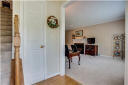 Warm and inviting foyer offers hardwood floors.