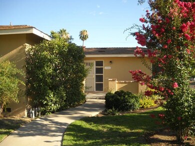 Mature landscaping with sprinkler system. Security