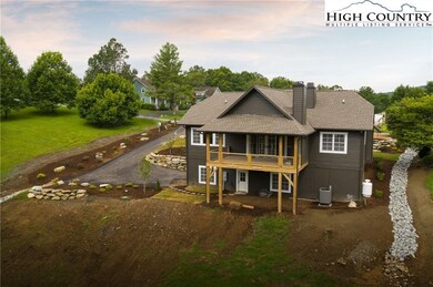 Rear view of home, notice the large covered porch,