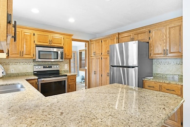 Granite tops, built in desk and stainless steel appliances