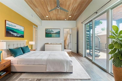 Bedroom with wooden ceiling, access to exterior, 