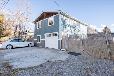 View of home's exterior featuring concrete driveway and a garage