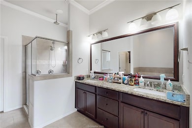 Bathroom featuring a shower stall, tile patterned
