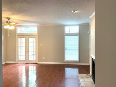 Large greatroom with fireplace and access to priva