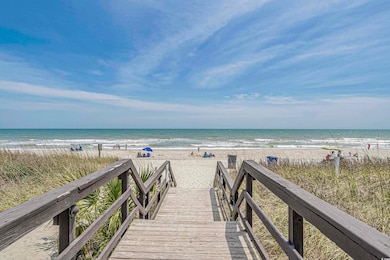 View of property's community with a beach view and