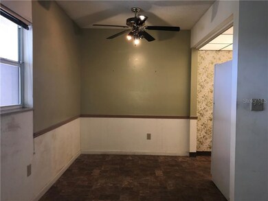 Dining area, kitchen to right.