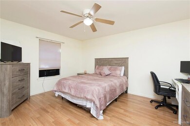 Bedroom with light wood-type flooring and ceiling fan