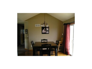 Vaulted ceiling and beautiful wood floors.