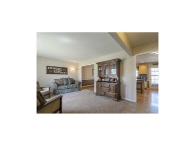 View of living room as seen from the entry.  Showi