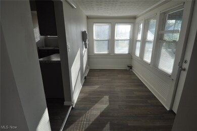 Laundry room with vinyl/LVT flooring. W/D hookups and dryer vent, plus front outside entrance