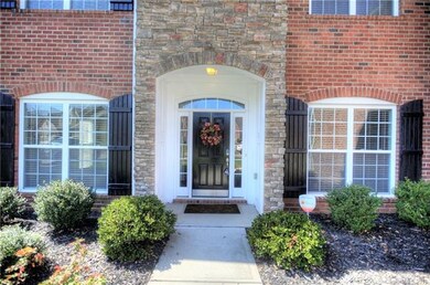 Beautiful wainscoting adorns covered porch.