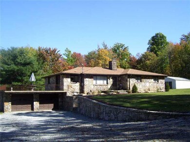 Exterior Front. large concrete deck off family roo